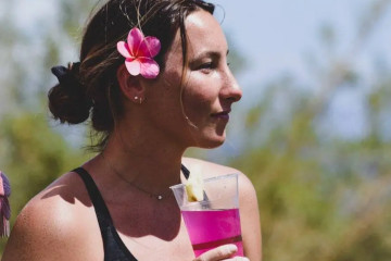 a woman drinking from a glass